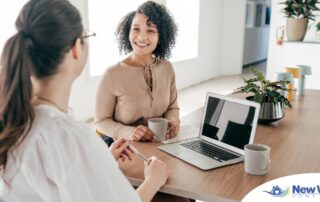 A woman interviews for a job position representing one of the steps during which a caregiver should be evaluating if an agency is a good fit.