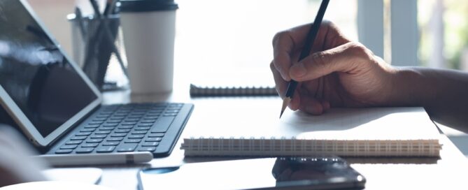 A man studies, representing how professional caregivers should continue to try and learn.