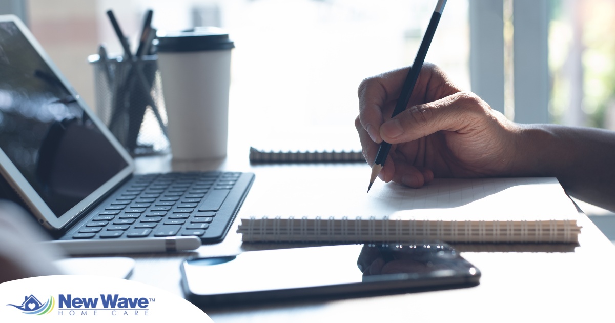 A man studies, representing how professional caregivers should continue to try and learn.